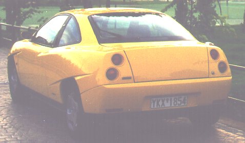 [Nicktop by his Fiat.]